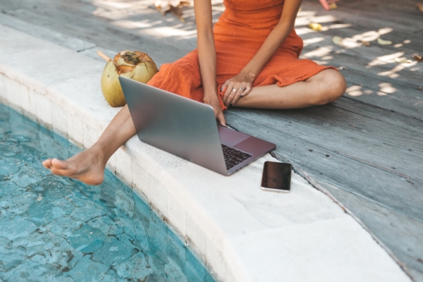 Why Modern Cannabis Culture Looks Nothing Like 2016 2 Image Of Woman By Pool With Laptop